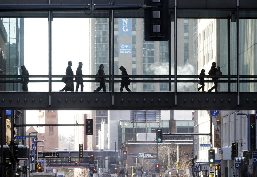 The climate-controlled skyway system in Minneapolis provides warmth for people moving from building to building as another polar blast brought sub-zero temperatures with wind chills in the minus-40's, Monday, Jan. 27, 2014. Subzero temperatures, high winds and drifting snow have closed schools and major roadways in Minnesota, with state officials cautioning against unnecessary travel. (AP Photo/Jim Mone)