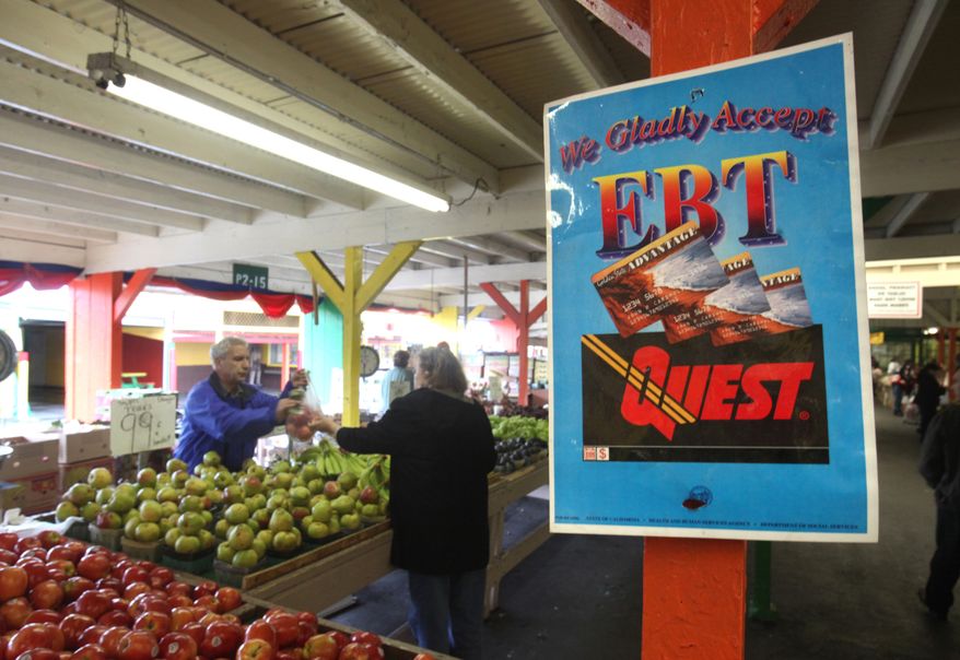 FILE - This Feb. 6, 2010 file photo shows a sign announcing the acceptance of electronic Benefit Transfer cards at a farmers market in Roseville, Calif. The House has voted to cut nearly $4 billion a year from food stamps, a 5 percent reduction to the nation's main feeding program used by more than 1 in 7 Americans. (AP Photo/Rich Pedroncelli, File)