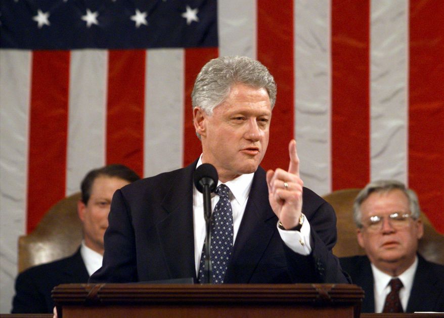 In this Jan. 19, 1999, file-pool photo, then-President Bill Clinton gestures while giving his State of the Union address on Capitol Hill in Washington. (AP Photo/Win McNamee, File-Pool)