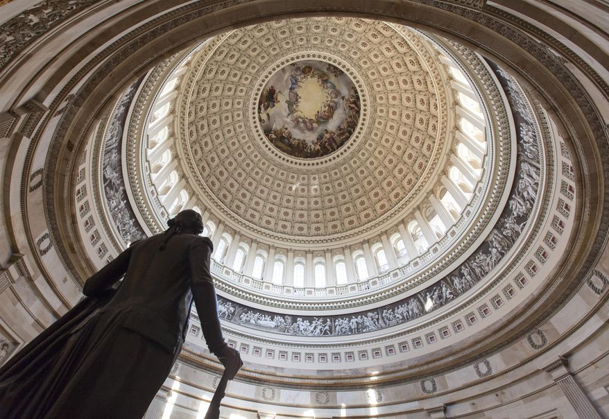 The Capitol Rotunda looms over the statue of George Washington on Capitol Hill in Washington, Monday, Jan. 27, 2014, as the House and Senate resume work in Washington. President Barack Obama will deliver his State of the Union address Tuesday night to a joint session of Congress. (AP Photo/J. Scott Applewhite)