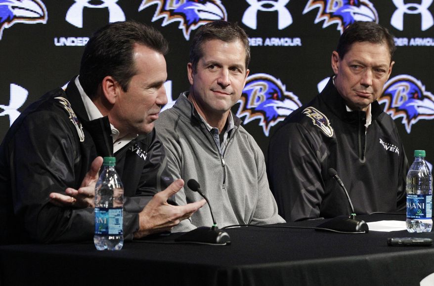 Baltimore Ravens head coach John Harbaugh, center, and quarterbacks coach Rick Dennison, right, listen as offensive coordinator Gary Kubiak speaks at an NFL football news conference, Monday, Jan. 27, 2014, in Owings Mills, Md. The former Houston Texans head coach replaces Jim Caldwell, who left to become coach of the Detroit Lions. (AP Photo/Patrick Semansky)