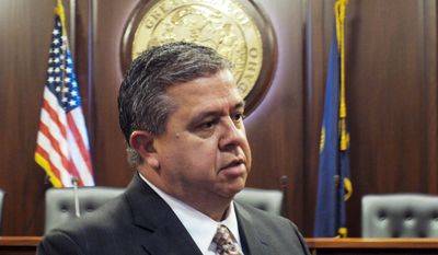 Superintendent of Public Instruction Tom Luna, a Republican, speaks to reporters after he announced Monday, Jan. 27, 2014 at the Idaho Capitol that he won't run for a third term in 2014. (AP Photo/John Miller)
