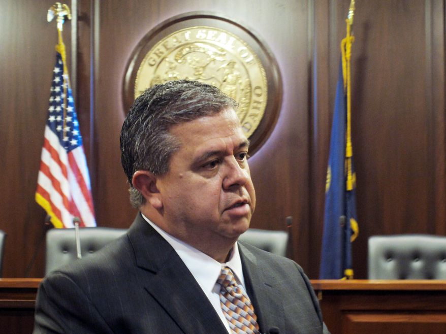 Superintendent of Public Instruction Tom Luna, a Republican, speaks to reporters after he announced Monday, Jan. 27, 2014 at the Idaho Capitol that he won't run for a third term in 2014. (AP Photo/John Miller)