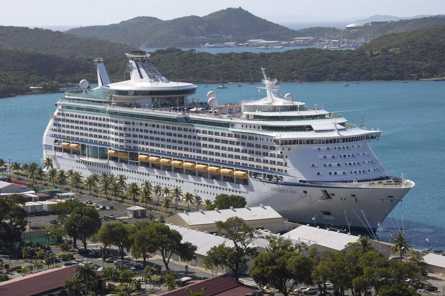 The Royal Caribbean International&#39;s Explorer of the Seas is docked at Charlotte Amalie Harbor in St. Thomas, U. S. Virgin Islands, Sunday, Jan. 26, 2014. U.S. health officials have boarded the cruise liner to investigate an illness outbreak that has stricken at least 300 people with gastrointestinal symptoms including vomiting and diarrhea. (AP Photo/Thomas Layer)