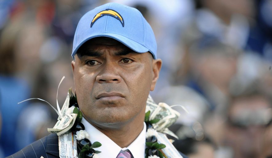 FILE - This Nov. 27, 2011 file photo shows late NFL star Junior Seau during his induction into the San Diego Chargers Hall of Fame in San Diego. The family of Junior Seau plans to object to the proposed $765 million settlement of player concussion claims because the fund would not pay wrongful death claims to survivors. (AP Photo/Denis Poroy, file)