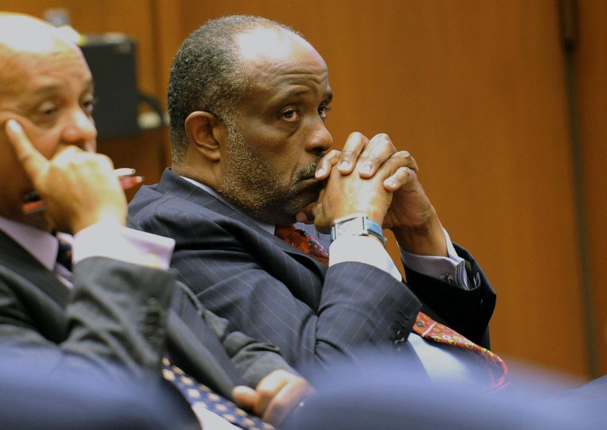 In this Thursday, Jan. 16, 2014, file photo, State Sen. Roderick Wright, D-Inglewood, right, listens during his perjury and voter fraud trial at Los Angeles Superior court. Roderick Wright has been convicted in a perjury and voter fraud case. A Los Angeles County Superior Court jury returned the verdict Tuesday, Jan. 28. 2014, on eight counts against the Democrat. Prosecutors said Wright sought to appear to have moved into an Inglewood property he owned in order to run in what at the time was the 25th Senate District but he actually lived outside the district. (AP Photo/The Daily Breeze, Stephen Carr, File) ** FILE **