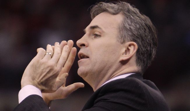 FILE - In this Nov. 20, 2013 file photo, American University's head coach Mike Brennan instructs his team against Ohio State during the first half of an NCAA college basketball game in Columbus, Ohio. From Princeton to American by way of Georgetown with a guard named "Peewee," Brennan has the Eagles unbeaten in the Patriot League in his first season at the school.  (AP Photo/Jay LaPrete, File)
