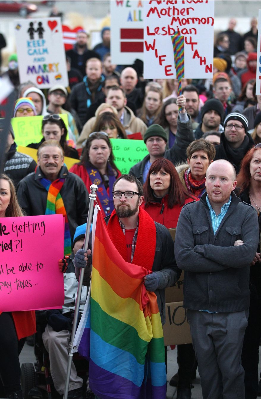 Supporters of gay marriage gather for a rally at the Utah State Capitol, Tuesday, Jan. 28, 2014, in Salt Lake City. Opponents and supporters of gay marriage held twin rallies at the Capitol on Tuesday. More than 1,000 gay couples rushed to get married when a federal judge overturned Utah's constitutional amendment banning same-sex marriage in late December 2013. In early January the U.S. Supreme Court granted Utah's request for an emergency halt to the weddings. (AP Photo/Rick Bowmer)