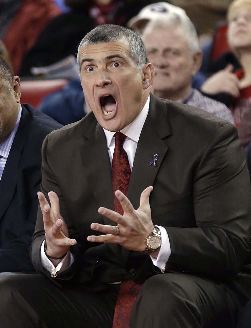 FILE - In this Jan. 22, 2014, file photo, South Carolina xoach Frank Martin reacts to a call in the first half of an NCAA college basketball game against Georgia in Athens, Ga. While the second-year coach sees the progress his young team has made at practices, Martin can't get past the mounting losses as the Gamecocks have started 0-6 in Southeastern Conference play. (AP Photo/John Bazemore, File)