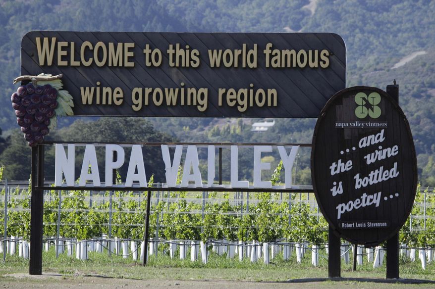 FILE - This Oct. 27, 2011, file photo shows a sign along Highway 29 welcoming visitors to the Napa Valley in Oakville, Calif. Napa Valley wine grape growers said Tuesday, Jan. 28, 2014, some vines are ripening early and that farmers are planning fewer crops to save water. (AP Photo/Eric Risberg, File)