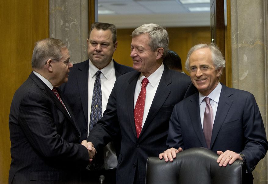 Retiring Montana Sen. Max Baucus, center, shakes hands with Senate Foreign Committee Chairman Sen. Bob Menendez, D-NJ., accompanied by the committee's ranking Republican Sen. Bob Corker, R-Tenn., right, and Sen. Jon Tester, D-Mont., on Capitol Hill in Washington, Tuesday, Jan. 28, 2014, prior to the start of the committee's hearing on Baucus nomination to become US ambassador to China. The six-term Democratic Senator is expected to sail towards confirmation by his colleagues. If confirmed, Baucus would replace Gary Locke. (AP Photo/Pablo Martinez Monsivais)