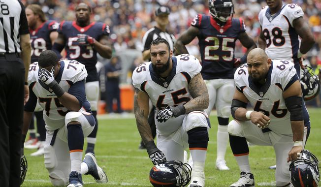 FILE - In this Dec. 22, 2013 file photo, Denver Broncos guard Louis Vasquez (65) and Manny Ramirez (66) kneel after a player injury during the first quarter of an NFL football game against the Houston Texans, in Houston. (AP Photo/David J. Phillip, File)