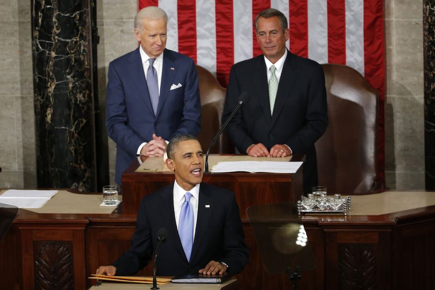 President Barack Obama takes the podium to give his State of the Union address on Capitol Hill in Washington, Tuesday Jan. 28, 2014. Vice President Joe Biden and House Speaker John Boehner of Ohio are behind the president. (AP Photo/Charles Dharapak)