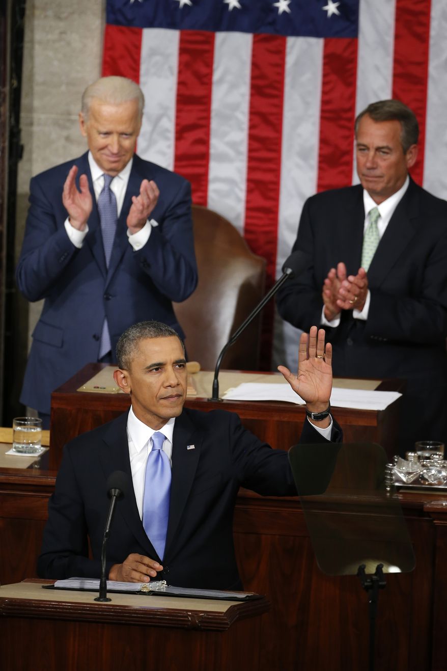 President Barack Obama waves before giving his State of the Union address on Capitol Hill in Washington, Tuesday Jan. 28, 2014. Vice President Joe Biden and House Speaker John Boehner of Ohio applaud behind the president. (AP Photo/Charles Dharapak)