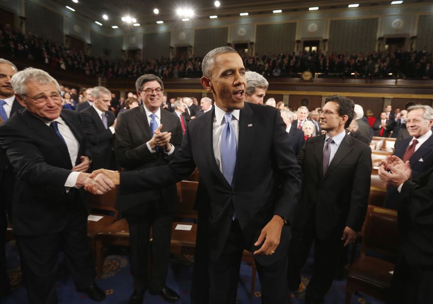 U.S. President Barack Obama shakes hands with Defense Secretary Chuck Hagel (L) as Treasury Secretary Jack Lew (2nd L) looks on before the President delivers his State of the Union speech on Capitol Hill in Washington, January 28, 2014. REUTERS/Larry Downing (UNITED STATES - Tags: POLITICS)