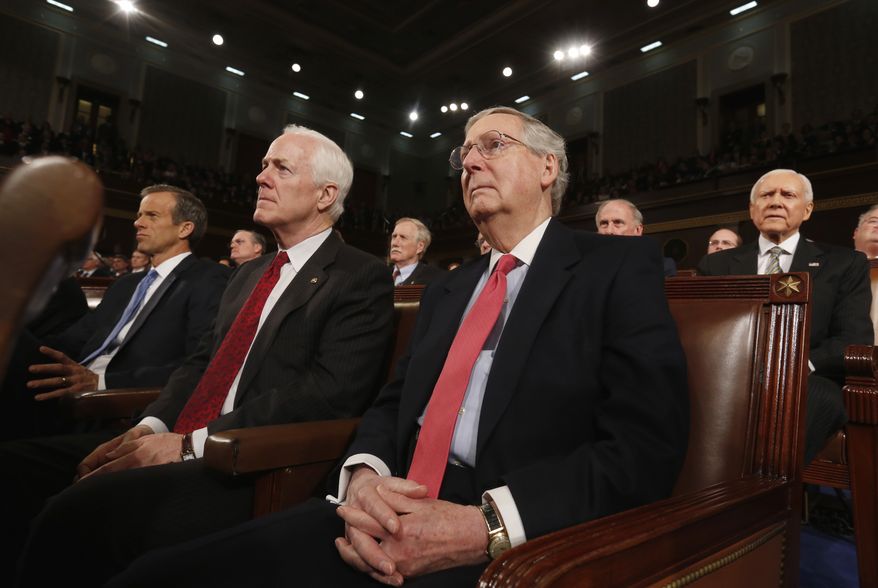 Members of the Senate Republican leadership, Conference Chair John Thune (L), Minority Whip John Cornyn, Minority Leader Mitch McConnell (2nd R) and Senator Orrin Hatch (R), listen as President Barack Obama delivers his State of the Union speech on Capitol Hill in Washington, January 28, 2014. REUTERS/Larry Downing (UNITED STATES - Tags: POLITICS)