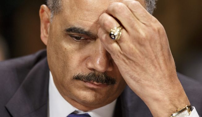 ** FILE ** Attorney General Eric Holder pauses while testifying on Capitol Hill in Washington, Wednesday, Jan. 29, 2014, before the Senate Judiciary Committee oversight hearing on the Justice Department. (AP Photo/J. Scott Applewhite)