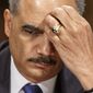 ** FILE ** Attorney General Eric Holder pauses while testifying on Capitol Hill in Washington, Wednesday, Jan. 29, 2014, before the Senate Judiciary Committee oversight hearing on the Justice Department. (AP Photo/J. Scott Applewhite)