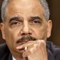 HOLDING: &quot;All the options that we have are on the table,&quot; says Attorney General Eric H. Holder Jr., who insists his department&#x27;s inquiry into the IRS is free from politics. (Associated Press)