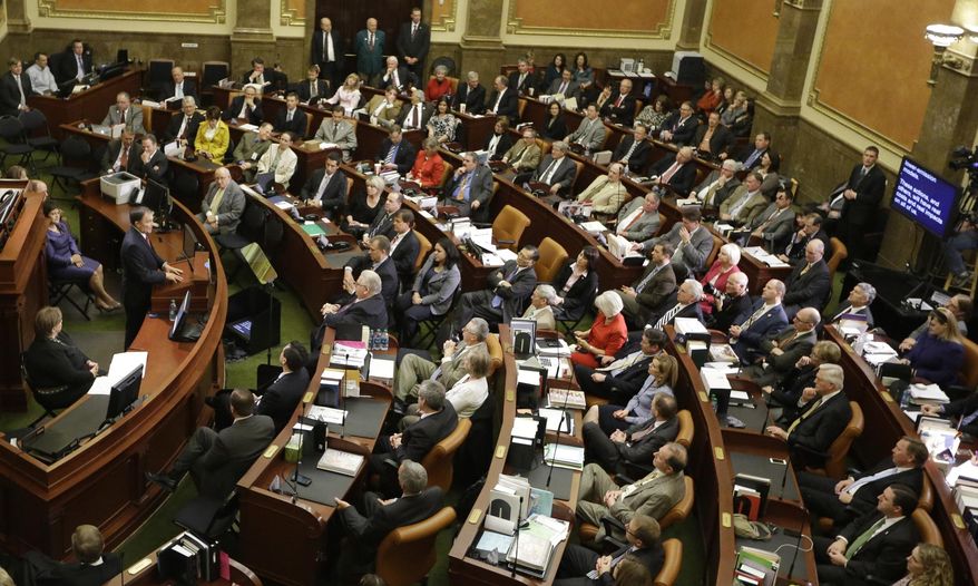 Utah Gov. Gary Herbert, left, delivers his fifth annual State of the State address Wednesday, Jan. 29, 2014, in Salt Lake City. Herbert detailed his priorities for 2014 after making air quality and education high-profile issues in his proposed $13.3 billion budget.  (AP Photo/Rick Bowmer)