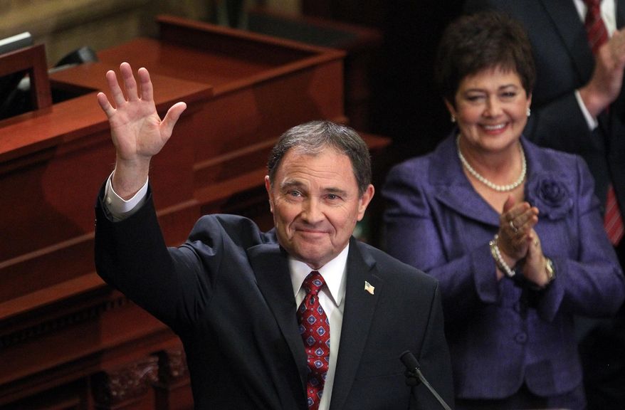 Gov. Gary Herbert waves to the crowd after delivering his fifth annual State of the State address Wednesday, Jan. 29, 2014, in Salt Lake City. Herbert detailed his priorities for 2014 after making air quality and education high-profile issues in his proposed $13.3 billion budget.  (AP Photo/Rick Bowmer)