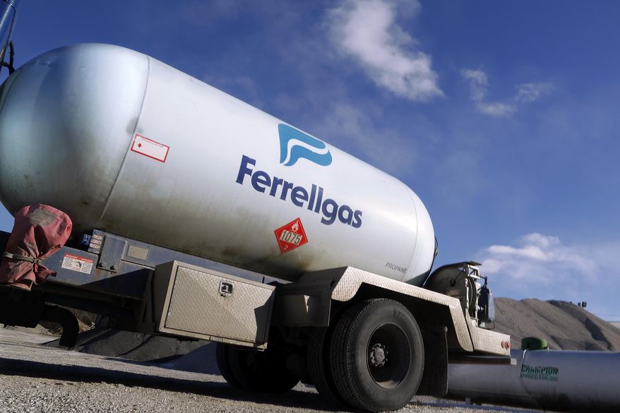 Propane is delivered to the Gardner Township Hall Monday, Jan. 27, 2014, in Bradforton, Ill., as central Illlinois experiences another blast of cold air. On Monday, Jan. 27, 2014, Illinois Gov. Pat Quinn declared a propane supply emergency in Illinois. Wet fall weather and recent cold spells have combined to put a pinch on Illinois' propane supplies, causing distribution problems across the state. (AP Photo/Seth Perlman)