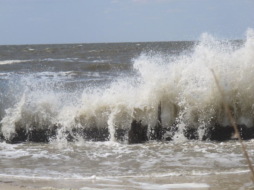 In this April 2, 2013 photo, the Delaware Bay surf pounds the remnants of a bulkhead in Middle Township, N.J., that has been destroyed by years of wave action. Some Delaware Bay communities say their losses from the storm have been overshadowed by more extensive damage along the ocean, and are backing a proposed national fund to prevent and respond to severe weather emergencies. (AP Photo/Wayne Parry)