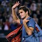 Roger Federer of  Switzerland walks off the Rod Laver Arena after his semifinal loss to Rafael Nadal of Spain during their semifinal at the Australian Open tennis championship in Melbourne, Australia, Friday, Jan. 24, 2014.(AP Photo/Andrew Brownbill)
