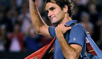 Roger Federer of  Switzerland walks off the Rod Laver Arena after his semifinal loss to Rafael Nadal of Spain during their semifinal at the Australian Open tennis championship in Melbourne, Australia, Friday, Jan. 24, 2014.(AP Photo/Andrew Brownbill)