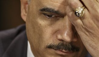 Attorney General Eric Holder pauses while testifying on Capitol Hill in Washington, Wednesday, Jan. 29, 2014, before the Senate Judiciary Committee hearing oversight hearing on the Justice Department. (AP Photo/J. Scott Applewhite)