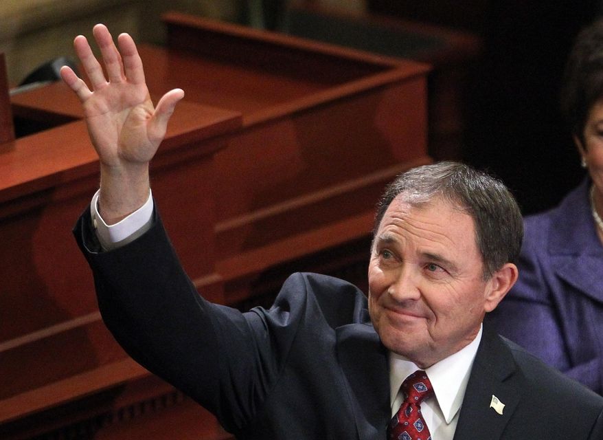 Gov. Gary Herbert waves to the crowd after delivering his fifth annual State of the State address Wednesday, Jan. 29, 2014, in Salt Lake City. Herbert detailed his priorities for 2014 after making air quality and education high-profile issues in his proposed $13.3 billion budget.  (AP Photo/Rick Bowmer)