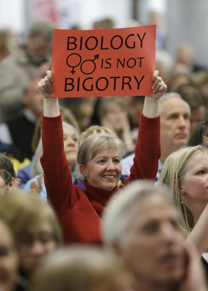 Opponents for gay marriage show their support during a rally at the Utah State Capitol Tuesday, Jan. 28, 2014, in Salt Lake City. Opponents and supporters of gay marriage held twin rallies at the Utah State Capitol on Tuesday evening. The opposing gatherings are the latest square-off over gay marriage, an issue that took Utah by surprise over the past month. More than 1,000 gay couples rushed to wed when a federal judge overturned Utah's constitutional amendment banning same-sex marriage in late December. Voters approved the amendment in 2004. Same-sex marriages continued in Utah until early January, when the U.S. Supreme Court granted Utah's request for an emergency halt to the weddings. (AP Photo/Rick Bowmer)