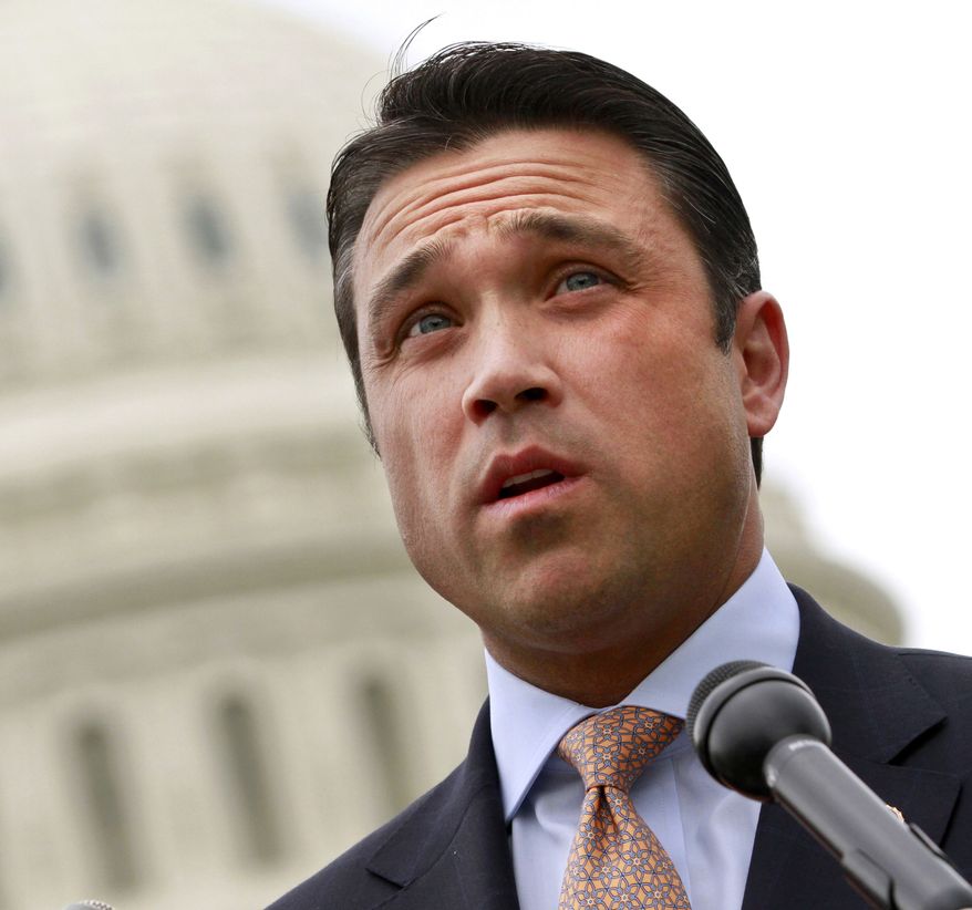 ** FILE ** This May 9, 2012, file photo shows Rep. Michael Grimm, R-N.Y. speaking on Capitol Hill in Washington. Grimm is defending his actions after he physically threatened a reporter at the Capitol after President Barack Obama's State of the Union address Tuesday, Jan. 28, 2014. After cutting the interview short, Grimm told New York cable news station NY1's Michael Scotto, "You ever do that to me again I'll throw you off this (expletive) balcony." He also threatened to "break (Scotto) in half." (AP Photo/Jacquelyn Martin, File)