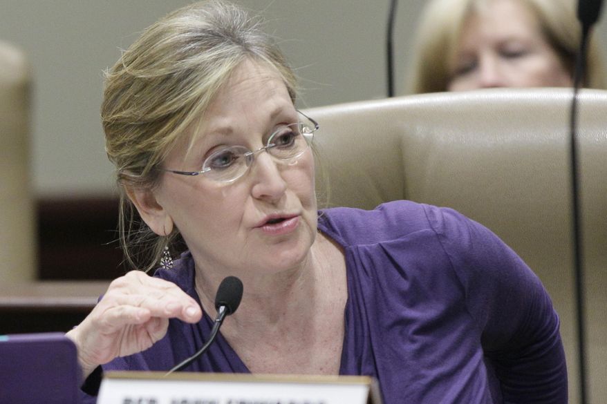 Rep. Ann Clemmer, R-Benton, speaks during a meeting of the House Rules Committee at the Capitol in Little Rock, Ark., Wednesday, Jan. 29, 2014. The committee recommended that Clemmer and another House member running for Congress be allowed to raise campaign funds during next month's legislative session. (AP Photo/Danny Johnston)