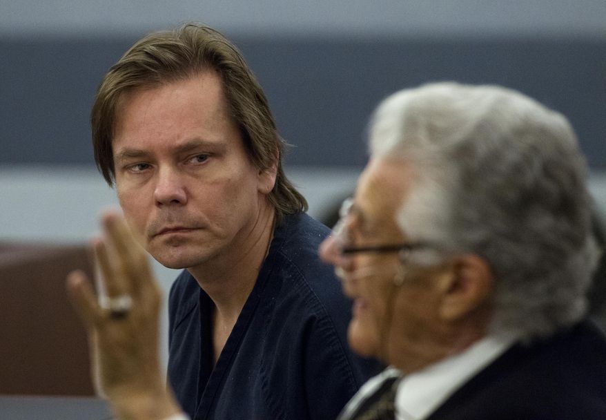 File-This Dec. 9, 2013 file photo shows Melvyn Perry Sprowson Jr. looking to his defense attorney John Momot during a preliminary hearing in Las Vegas. Sprowson is due for arraignment on Wednesday Jan. 29, 2014 in Nevada state court on charges that he kidnapped and made pornographic images of a 16-year-old girl who police found living at Sprowson's Henderson apartment last November. (AP Photo/Las Vegas Sun, L.E. Baskow,File)