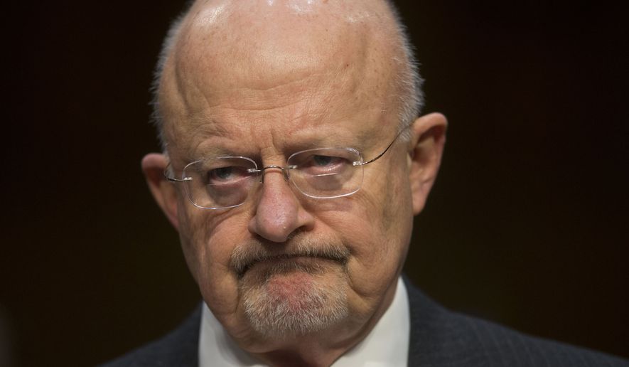** FILE ** Director of National Intelligence James Clapper listens as he testifies on Capitol Hill in Washington, Wednesday, Jan. 29, 2014, before the Senate Intelligence Committee hearing on current and projected national security threats against the U.S. (AP Photo/Pablo Martinez Monsivais)