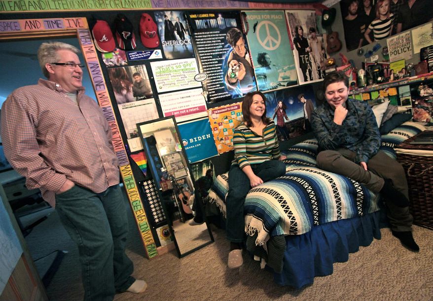 Ayden Prehara, talks with his parents, Todd and Chris, in his bedroom in Fitchburg, Wis., on Jan. 3, 2014. Prehara, 16, is a transgender student, having transitioned from female to male at age 14. This June, Ayden and his parents will travel to Cleveland for what, in the transgender community, is called "top surgery." His breasts will be flattened and his chest contoured to be more typically male. He will be 17 by then, about the earliest surgeons will do such surgery. Until then, he wears an undergarment called a binder that evens out his chest. The family is setting aside about $10,000 for the surgery, which includes a week or so in a Cleveland hotel during recovery, said Chris Prehara. Insurance does not cover any of it, she said. (Associated Press/Wisconsin State Journal, John Hart)