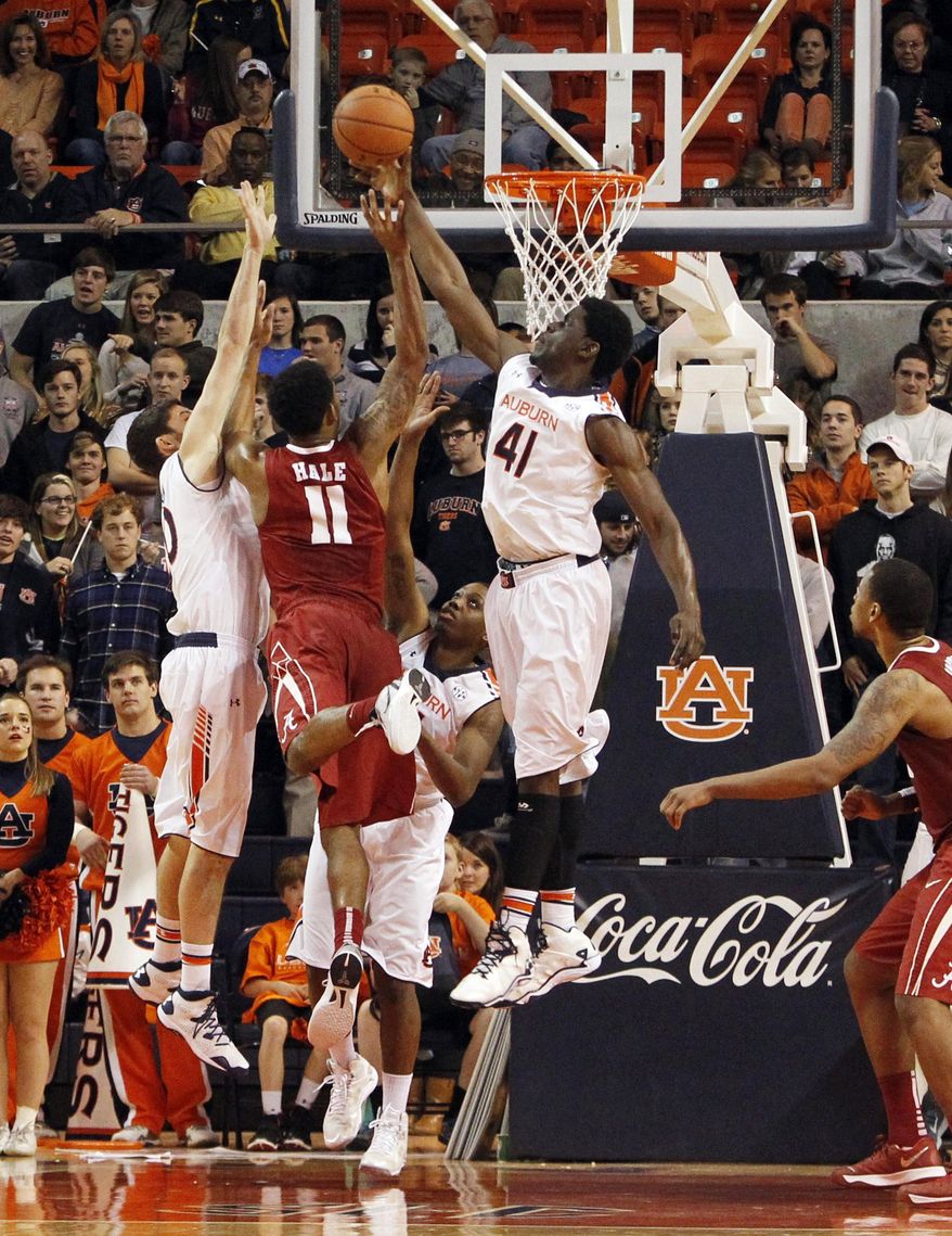 Auburn's Matthew Atewe (41) blocks the shot of Alabama's Shannon Hale (11) during the second half of an NCAA college basketball game, Thursday, Jan. 30, 2014, in Auburn, Ala. (AP Photo/Butch Dill)