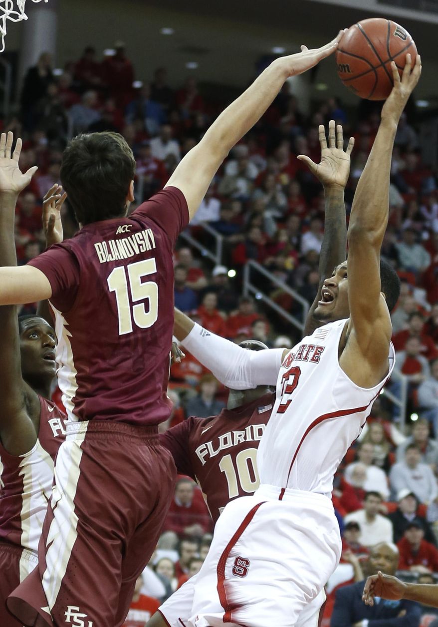 Florida State's Boris Bojanovsky (15) blocks the shot of N.C. State's Kyle Washington (32) during the first half of an NCAA basketball game, Wednesday, Jan. 29, 2014 in Raleigh, N.C. (AP Photo/The News & Observer, Ethan Hyman) MANDATORY CREDIT: ETHAN HYMAN, THE NEWS & OBSERVER