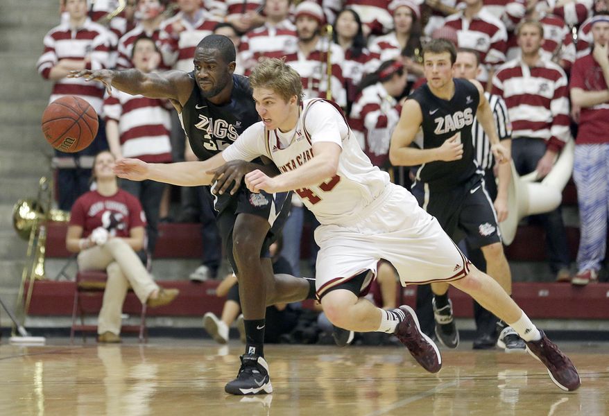 Santa Clara forward Nate Kratch (43) battles for a loose ball against Gonzaga forward Sam Dower, left, in the second half of an NCAA college basketball game Wednesday, Jan. 29, 2014, in Santa Clara, Calif. (AP Photo/Tony Avelar)