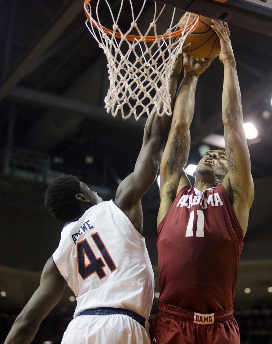 Auburn's Matthew Atewe (41) blocks a dunk-attempt by Alabama's Shannon Hale (11) during an NCAA college basketball game on Thursday, Jan. 30, 2014, in Auburn, Ala. (AP Photo/The Opelika-Auburn News, Albert Cesare)