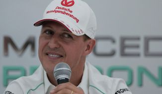 File - In this Thursday, Oct. 4, 2012 file photo, Michael Schumacher announces his retirement from Formula One at the end of the 2012 season during a press conference at the Suzuka Circuit venue for the Japanese Formula One Grand Prix in Suzuka, Japan. Michael Schumacher’s doctors have started the process of bringing the former Formula One champion out of the coma he has been in since a skiing accident a month ago, his manager said Thursday, Jan. 30, 2014. The 45-year-old Schumacher suffered serious head injuries when he fell and hit the right side of his head on a rock in the French resort of Meribel on Dec. 29.  (AP Photo/Itsuo Inouye, file)
