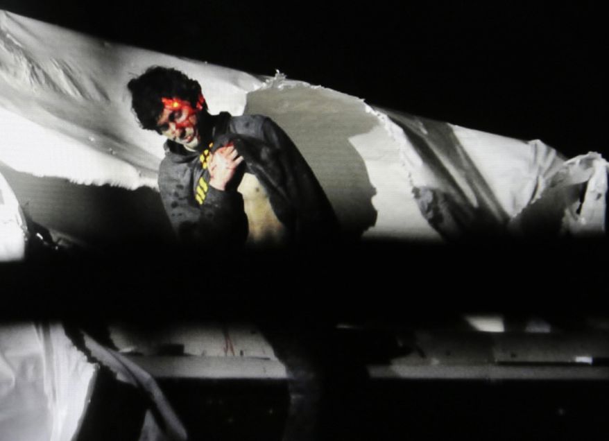 In this Friday, April 19, 2013, Massachusetts State Police file photo, 19-year-old Boston Marathon bombing suspect Dzhokhar Tsarnaev, bloody and disheveled with the red dot of a sniper&#39;s rifle laser sight on his head, emerges from a boat at the time of his capture by law enforcement authorities in Watertown, Mass. On Thursday, Jan. 30, 2014, U.S. Attorney General Eric Holder authorized the government to seek the death penalty in the case against Tsarnaev. (AP Photo/Massachusetts State Police, Sean Murphy, File)