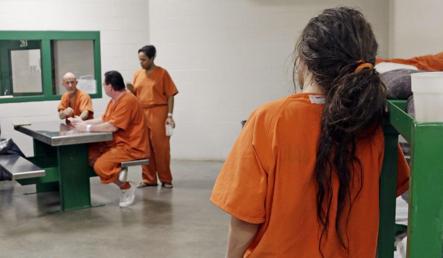 In this Dec. 10, 2013 file photo a prisoner leans against a bed frame in a new unit in the Harris County Jail for gay, bisexual and transgender inmates in Houston. Legislation taking effect on July 1, 2018, in Connecticut will give transgender inmates in that state the legal right to be housed in a prison that matches the gender with which they identify. (AP Photo/Pat Sullivan) **FILE**