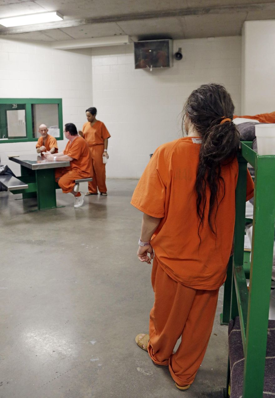In this Dec. 10, 2013 file photo a prisoner leans against a bed frame in a new unit in the Harris County Jail for gay, bisexual and transgender inmates in Houston. Legislation taking effect on July 1, 2018, in Connecticut will give transgender inmates in that state the legal right to be housed in a prison that matches the gender with which they identify. (AP Photo/Pat Sullivan) **FILE**