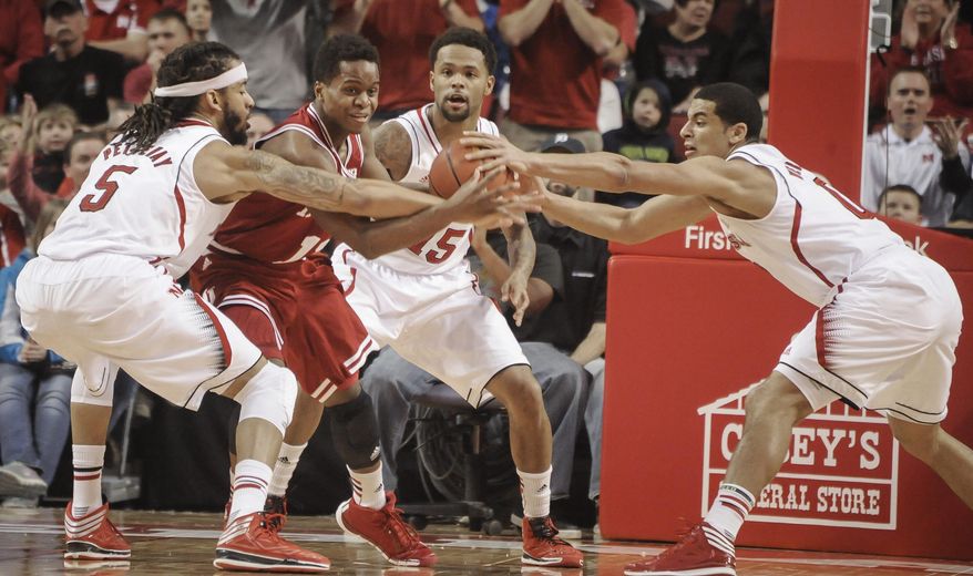 Nebraska guard/forward Terran Petteway (5) and guard Tai Webster (0) go for a loose ball against Indiana forward Hanner Mosquera-Perea (12) during an NCAA college basketball game, Thursday, Jan. 30, 2014 in Lincoln, Neb.(AP Photo/Dave Weaver)