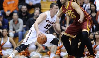 Southern California&#x27;s Omar Oraby (55) defends against Oregon State&#x27;s  Angus Brandt (12) during the first half of an NCAA college basketball game in Corvallis, Ore., Thursday Jan. 30, 2014.  (AP Photo/Greg Wahl-Stephens)