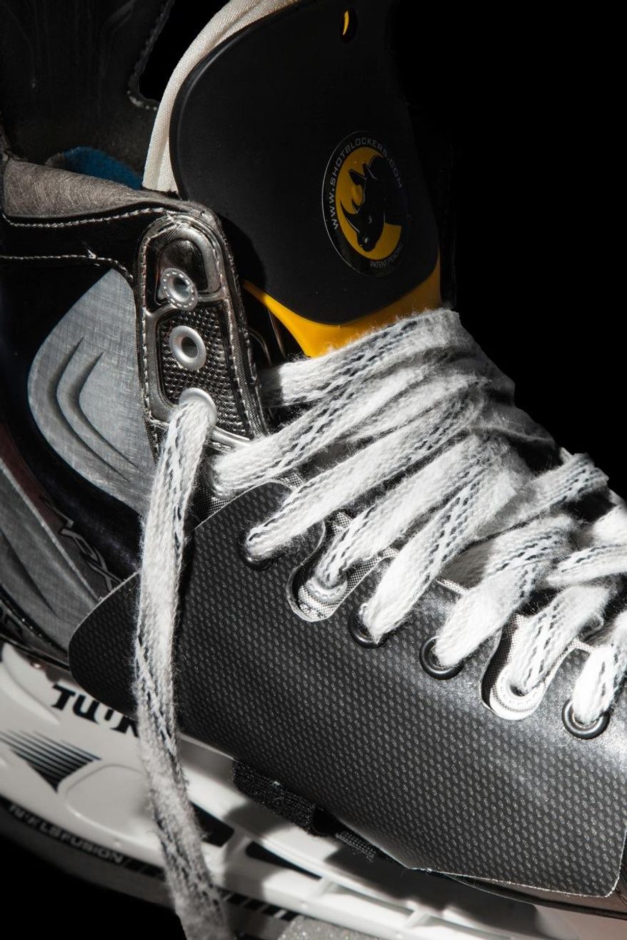 ADVANCE FOR WEEKEND EDITIONS, FEB. 1-2 - This undated product shot released by Exterior Skate Protection, shows the Shotblocker XT, top, for front hockey skate protection, and Shotblocker XT Lite, bottom, for side skate protection. According to the company's website, numerous NHL teams are using the equipment to help protect players ankles and feet from getting injured by flying pucks. Shot-blocking is one of the sport's under appreciated skills, but it can come with a price, as in a bruised or broken foot and an absence from the ice for days or weeks. (AP Photo/Exterior Skate Protection)