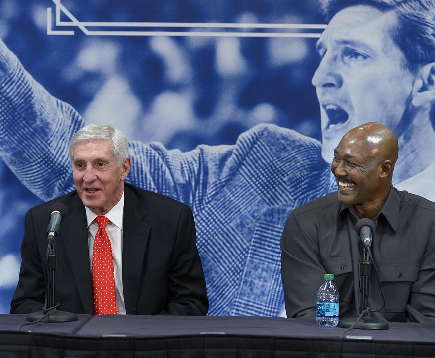 Karl Malone, right, laughs as former Utah Jazz coach Jerry Sloan speaks during a news conference to honor Sloan on Friday, Jan. 31, 2014, in Salt Lake City.  (AP Photo/The Salt Lake Tribune, Scott Sommerdorf) LOCAL TV OUT; MAGAZINES OUT; DESERET NEWS OUT