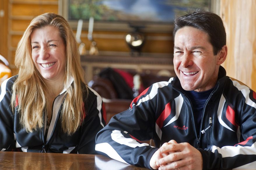 In this photo taken on Monday, Jan. 27, 2014, cross-country skiers Gary and Angelica di Silvestri smile during an interview at the Yellowstone Club in Big Sky, Mont. The American-born man and his Italian-born wife will be representing the tiny Caribbean island nation of Dominica at the Winter Olympics in Sochi next month. The former finance professionals, granted Dominica citizenship for their philanthropic work on the island, are finishing their training in Montana while hastily arranging their own visas, travel logistics and footing the bill for the entire expedition. (AP Photo/Janie Osborne)